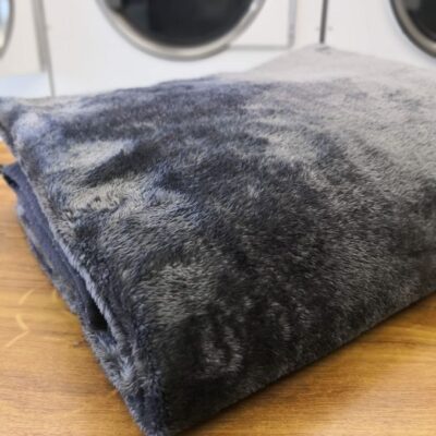Folded clean mink blanket in laundry